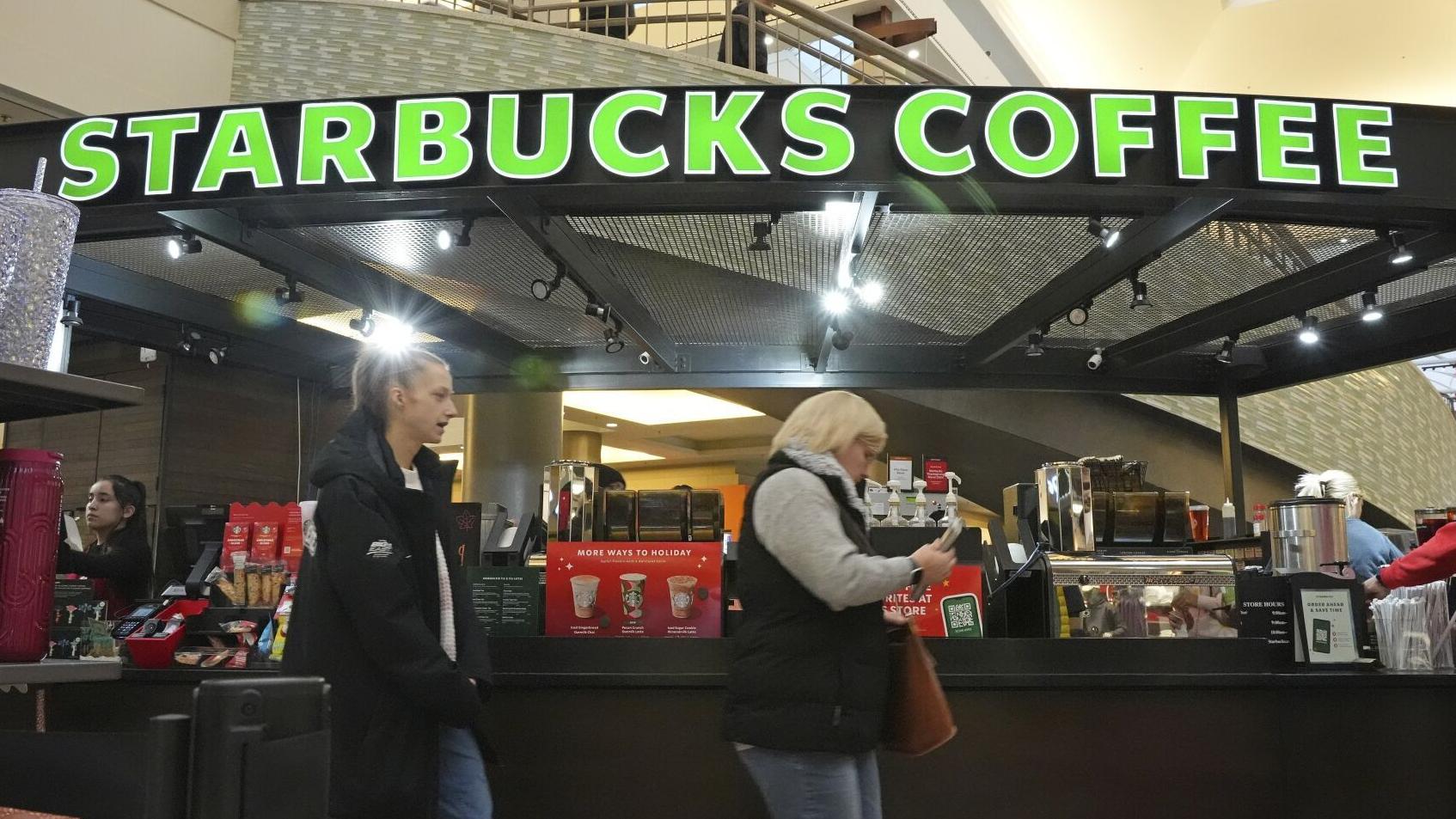 Starbucks workers begin strikes that could spread to hundreds of US stores by Christmas Eve